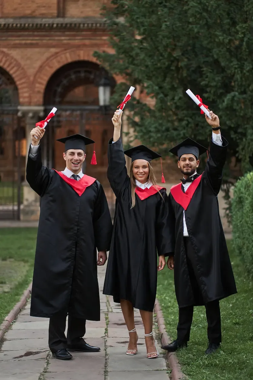international graduates from celebrating diplomas graduation robes